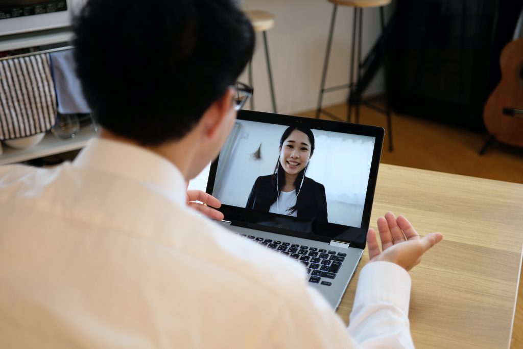 Asian Businessman Talking To Colleague On Web Meeting for Article about Online Job Interview Tips