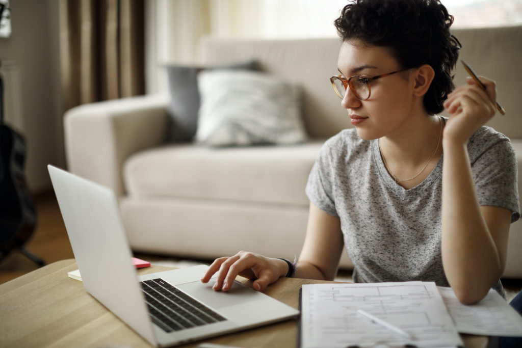 Young Woman Working At Home for article on how to explain an employment gap on resume