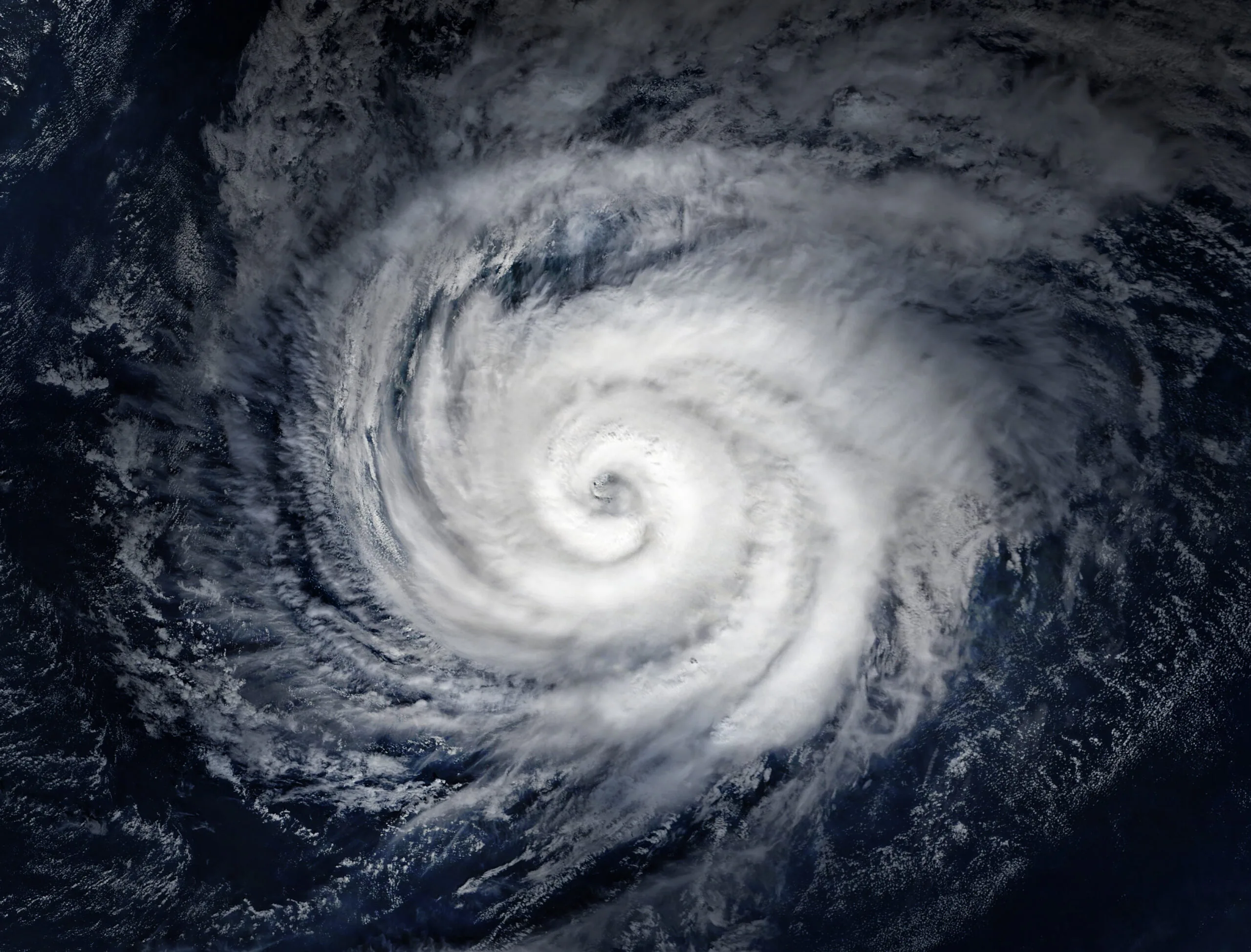 Read about: Aerial image of a hurricane over the water.