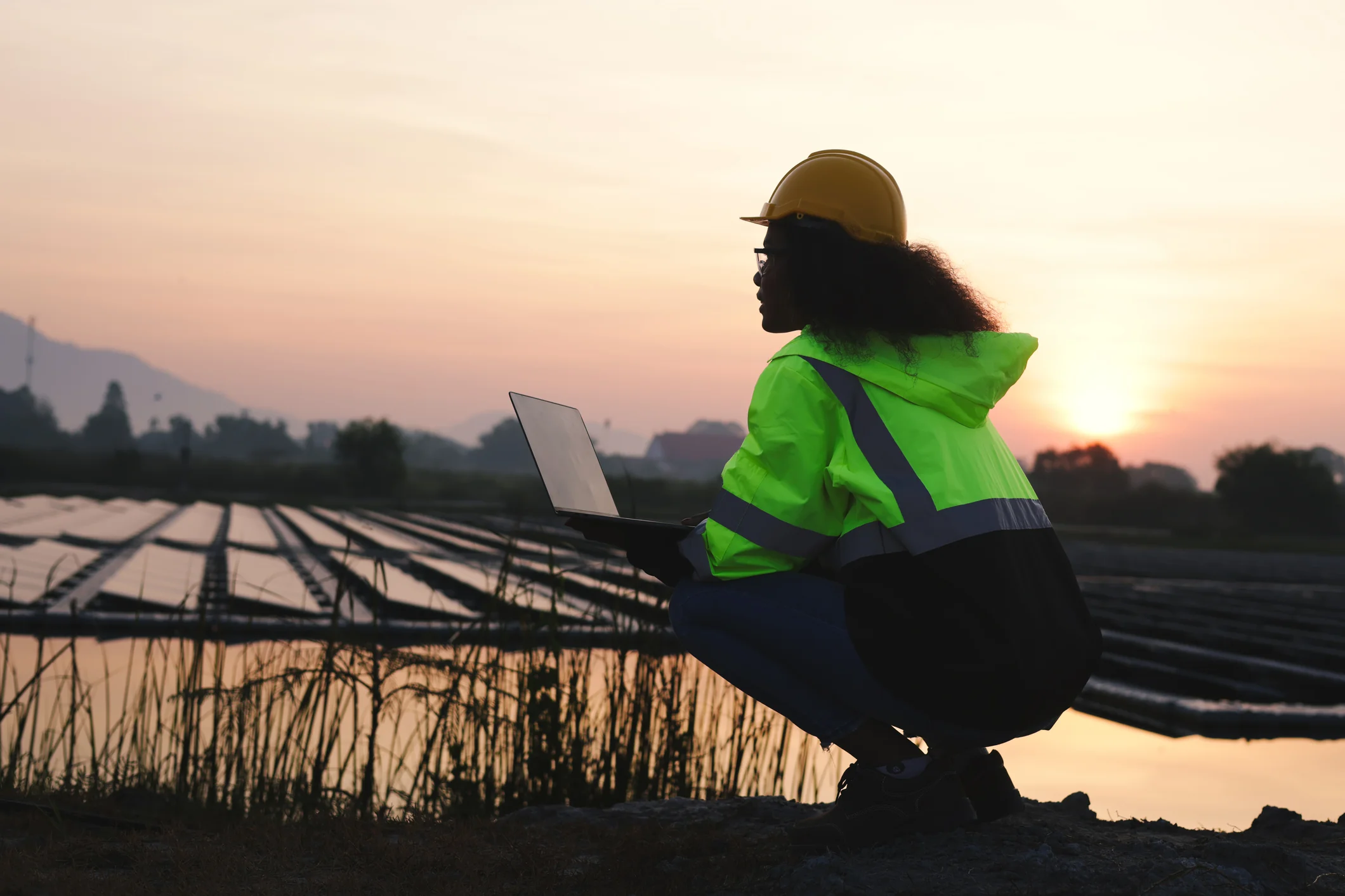 Read about: A woman in a hardhat holding a laptop looks out over a field of solar panels. Discover the top jobs in 2025.